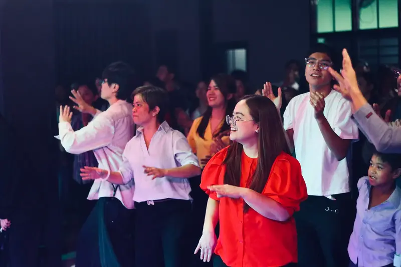 Church members dancing and celebrating during worship