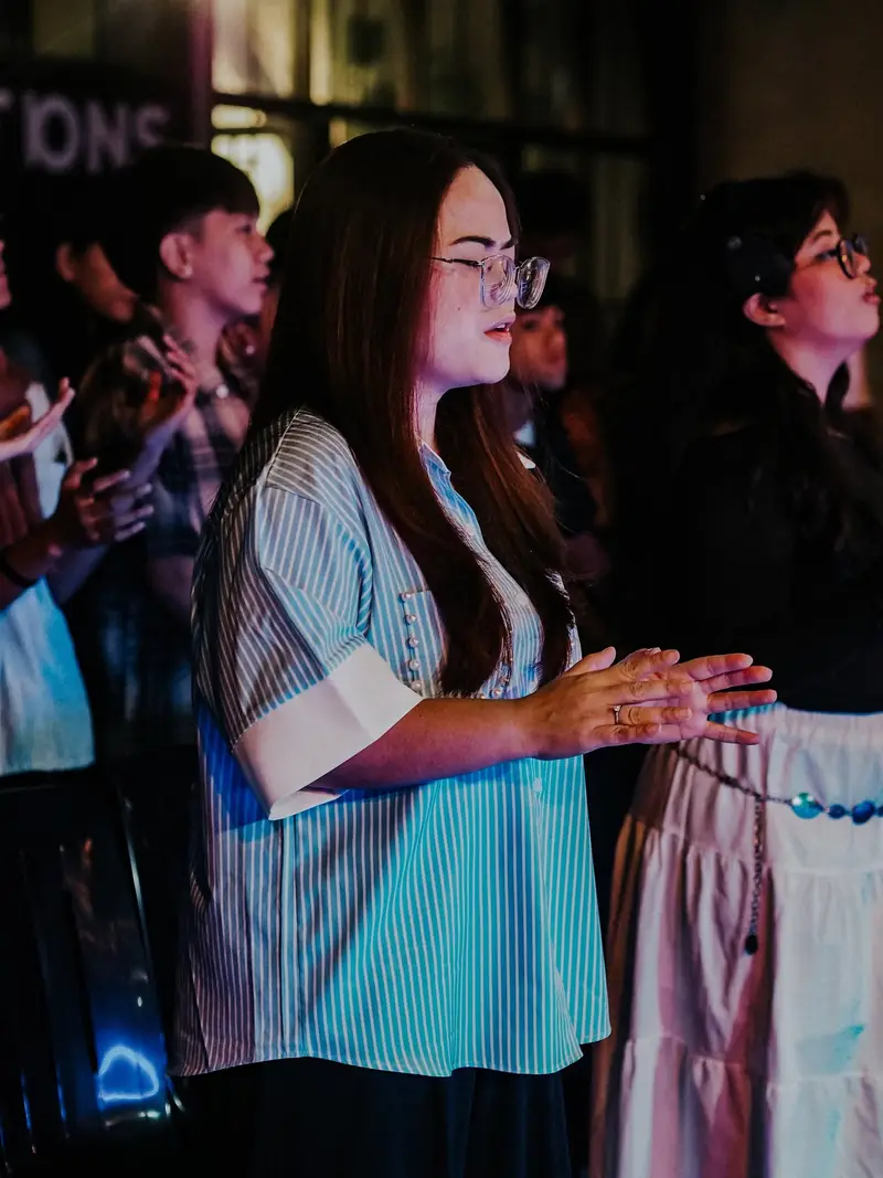 Women worshipping with open hands
